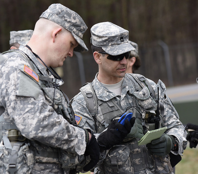 LAKE LANIER, Buford, Ga. March 19, 2016 – Sgt. 1st Class Tavares and Sgt. 1st Class Weeks of the Georgia State Defense Force verifying the reconnaissance data as they prepare to send out teams during the Lake Lanier Search and Rescue Exercise, involving a mock airplane crash scenario. The GSDF, Civil Air Patrol, and United States Coast Guard Auxiliary participated in this Multi-Agency Search and Rescue Mission. - Georgia State Defense Force photo by Pfc. Davidson