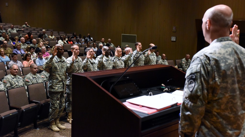 Lt. Col. Vance, Deputy Commander of Training and Doctrine Command, administers the oath of office to the graduates of the combined Officer Candidate/Warrant Officer Candidate School at the Georgia Public Safety Training Center in Forsyth, Georgia on August 14, 2016. (Georgia State Defense Force photo by Pfc. Davidson)